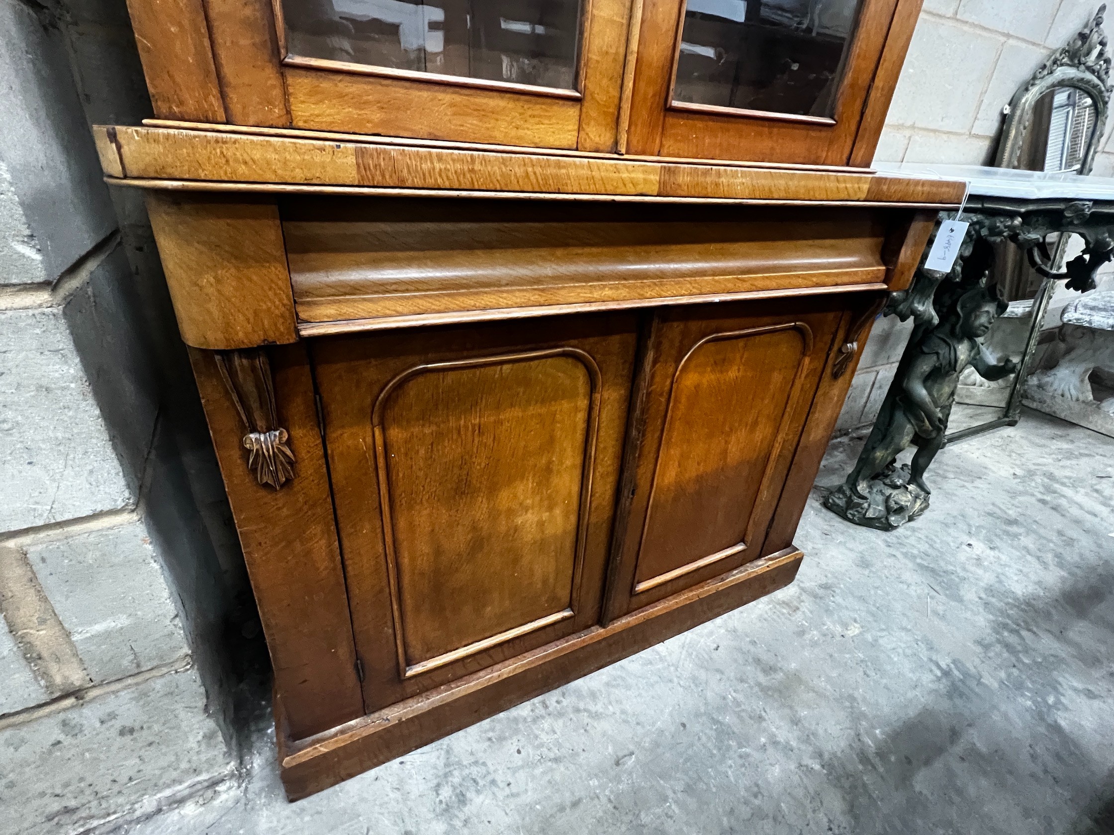 A Victorian oak bookcase cupboard, width 104cm, depth 42cm, height 200cm